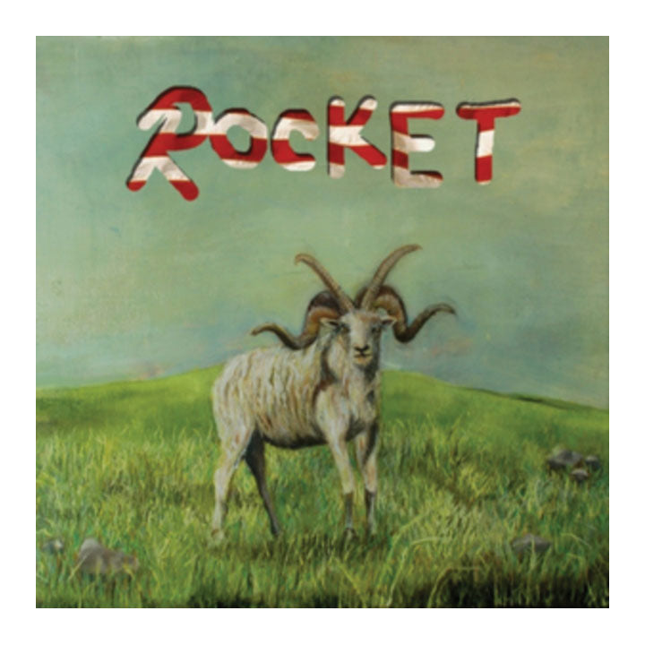 Album cover art for 'ROCKET' featuring a painted mountain billy goat in a grassy field under a muted green sky, with the album title in bold red and white letters at the top.
