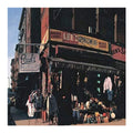 Street scene with vintage clothing store and signs in an urban setting