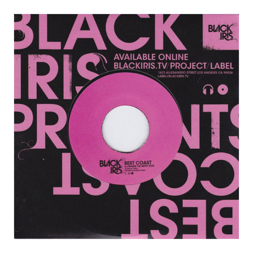 Vinyl record with pink label on a black background with text