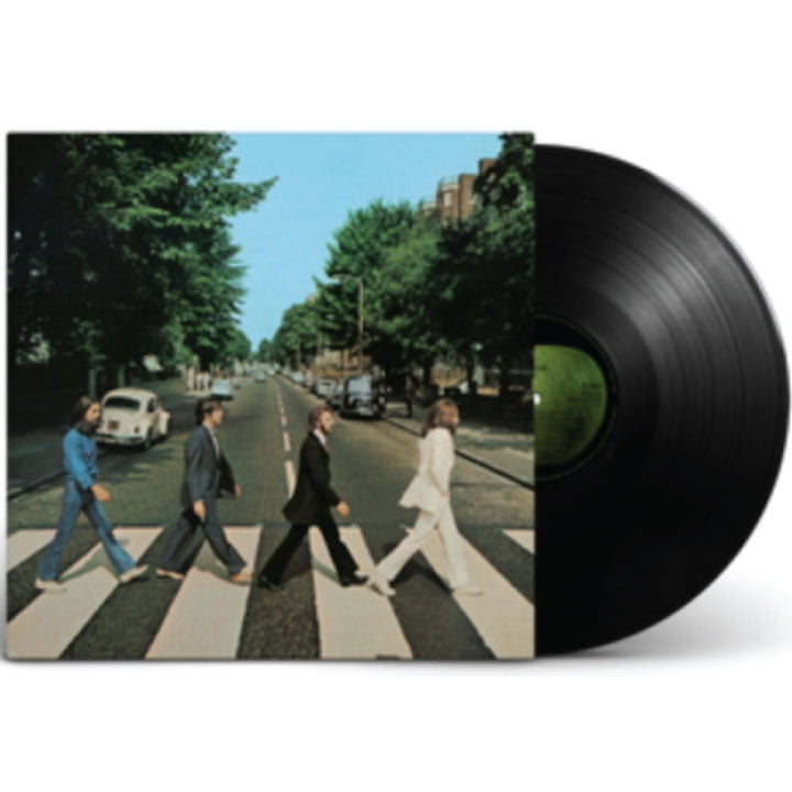 A vinyl record partially pulled from its sleeve, showing the iconic Abbey Road album cover with four band members walking across a zebra crossing on a tree-lined street. The black record is visible on the right against a plain white background.