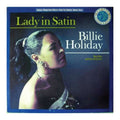 Billie Holiday 'Lady in Satin' vinyl record album cover, featuring a portrait of Billie Holiday in profile against a dark blue background with yellow and white text.