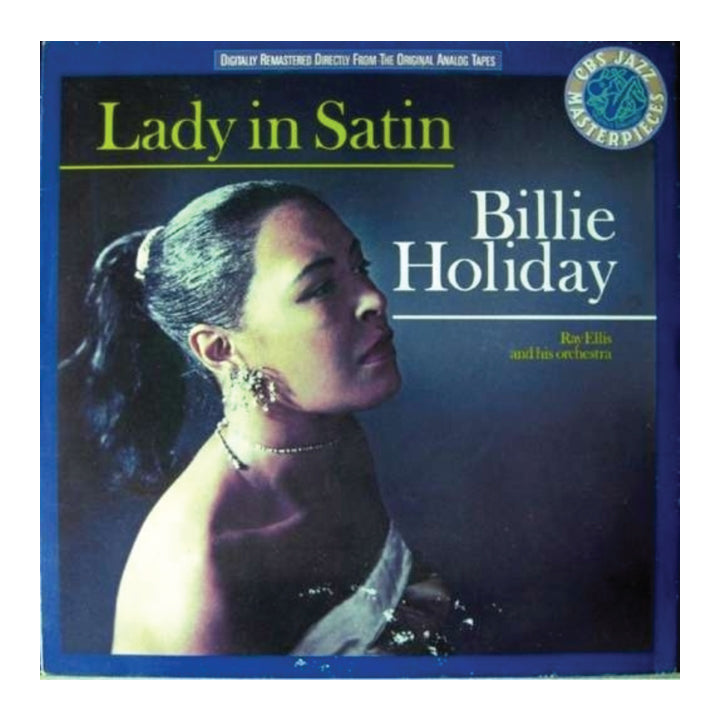 Billie Holiday 'Lady in Satin' vinyl record album cover, featuring a portrait of Billie Holiday in profile against a dark blue background with yellow and white text.
