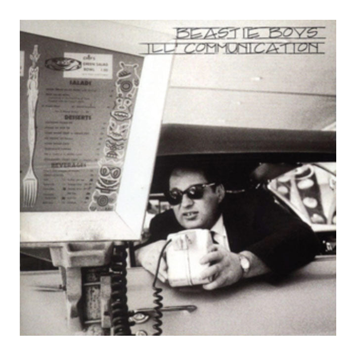 Black and white album cover with a person holding a cup, menu in the background