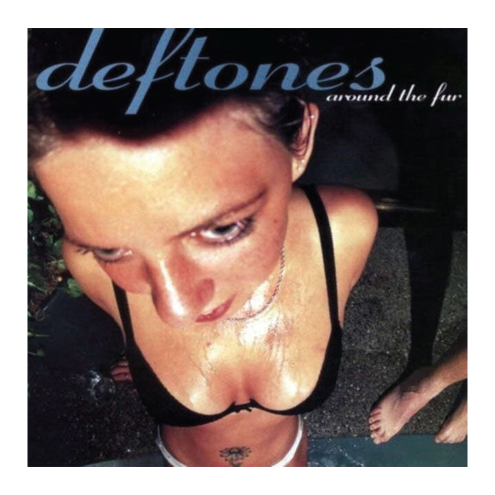 Album cover for 'Deftones' around the fur, with a person lying on the ground.