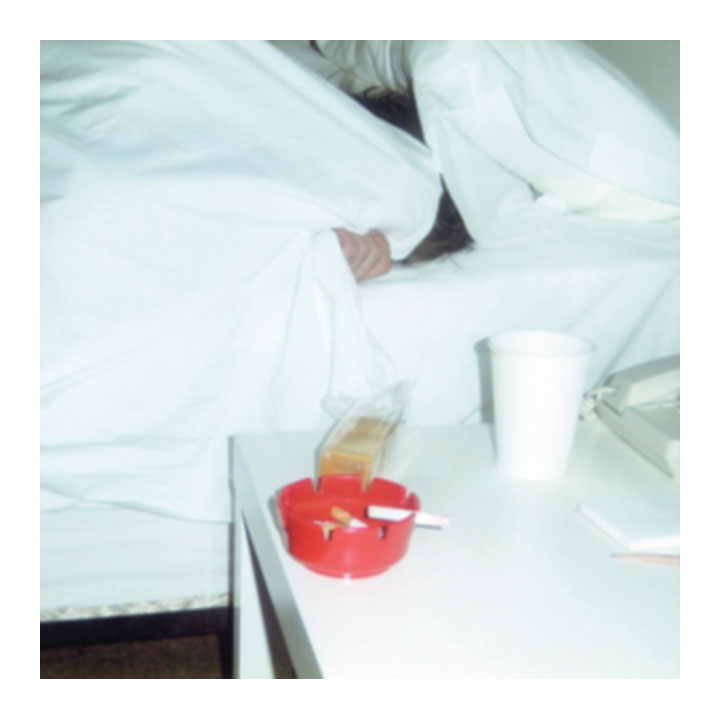 Person lying in bed with a red tray on a nightstand. Duster- Together album cover