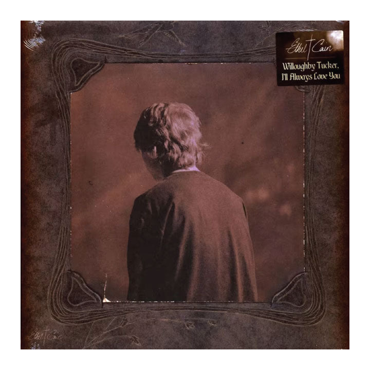 Album cover with a person from behind and decorative border, featuring the artist's name.