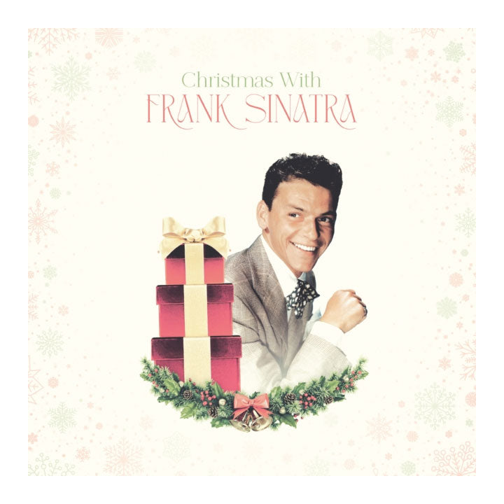 Album cover for Frank Sinatra's 'Christmas With Frank Sinatra', featuring a portrait of the artist next to a stack of red and gold gift boxes on a decorated green wreath, set against a cream background with subtle snowflakes.