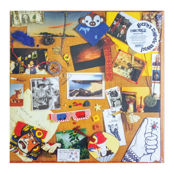 Memorable moments collage with various items and photos on a cork board.