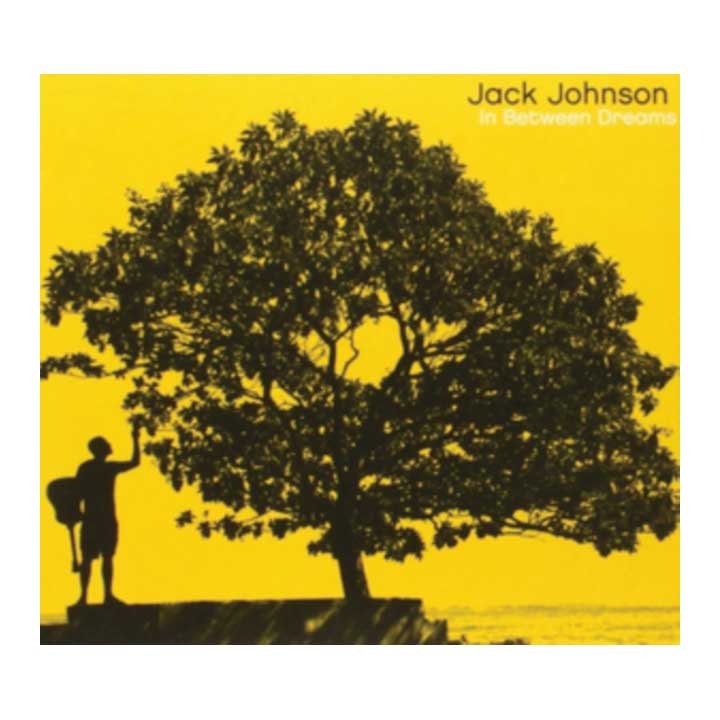 Album cover with silhouette of a person under a large tree against a yellow background, featuring the text 'Jack Johnson In Between Dreams'.