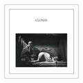 Album cover for 'Closer' with a black and white photo of two people lying on a bed.