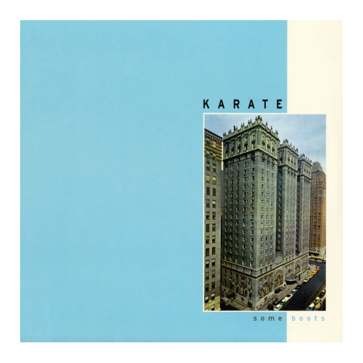 Album cover for 'KARATE' by some boats, featuring a large light blue background, a cream vertical band on the right, and a central square photograph of a city building.