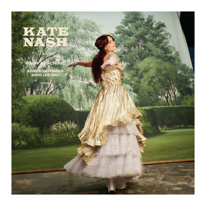 Album cover with a person in a gold and white dress against a garden background, featuring the text 'Kate Nash'.