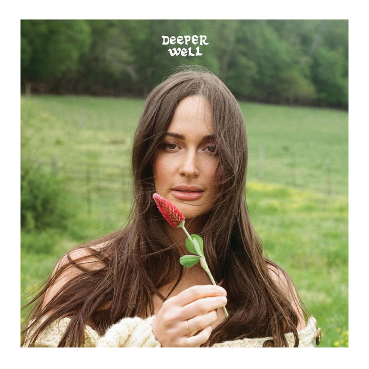 Woman holding a red flower with 'Deeper Well' text overlay in a natural setting