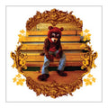 Person in a bear costume sitting on an ornate wooden bench with gold accents.