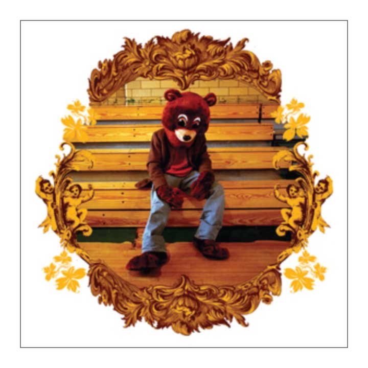 Person in a bear costume sitting on an ornate wooden bench with gold accents.