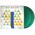 Mac Miller vinyl record album with a textured off-white cover featuring a blue vertical brushstroke and a geometric triangle pattern in green, yellow, and orange, shown next to two translucent green records.
