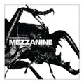 Album cover for Massive Attack's 'Mezzanine' featuring a high-contrast black and white close-up of a beetle with the album title in bold white text across the center.