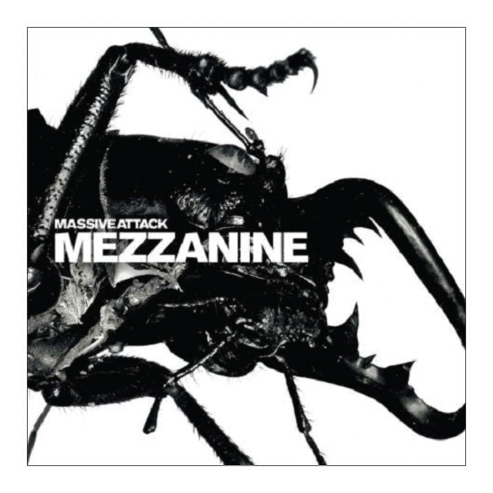 Album cover for Massive Attack's 'Mezzanine' featuring a high-contrast black and white close-up of a beetle with the album title in bold white text across the center.