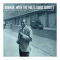 blue background, mile davis standing