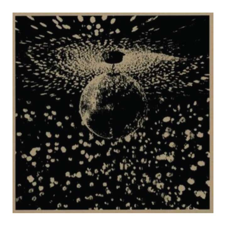 Abstract design with a central sphere and radiating patterns on a black background