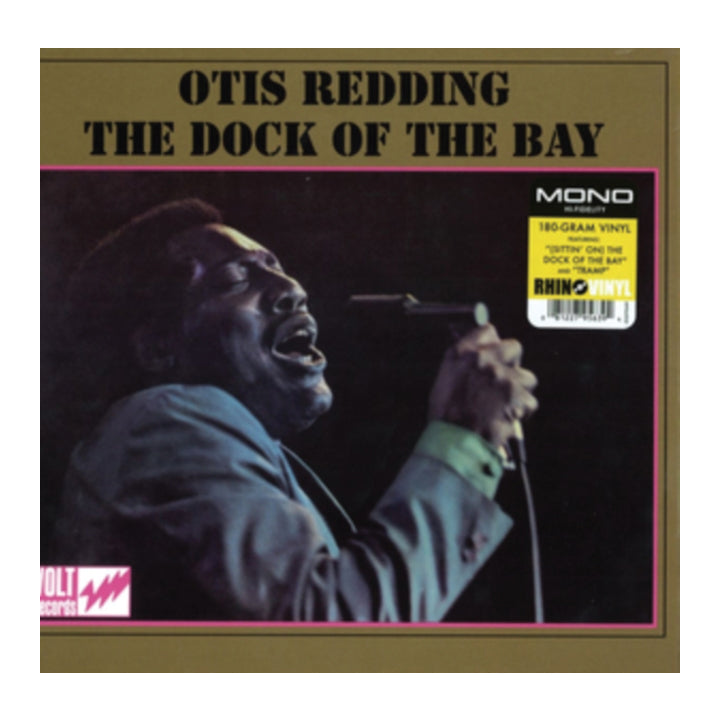 Otis Redding's 'The Dock of the Bay' vinyl record cover, featuring a portrait of the artist singing into a microphone. The album is presented on a gold background with a pink border and includes a yellow 'Mono' sticker on the right.