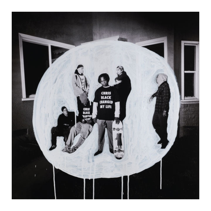 Black and white photo of a group of people inside a circular frame with text.