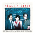 Album cover for the 'Reality Bites' original motion picture soundtrack, featuring three actors in front of a dark chalkboard background with handwritten words, framed by a cream border with red title text.
