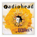 Album cover for 'Pablo Honey' by Radiohead featuring a yellow flower and a person's face.