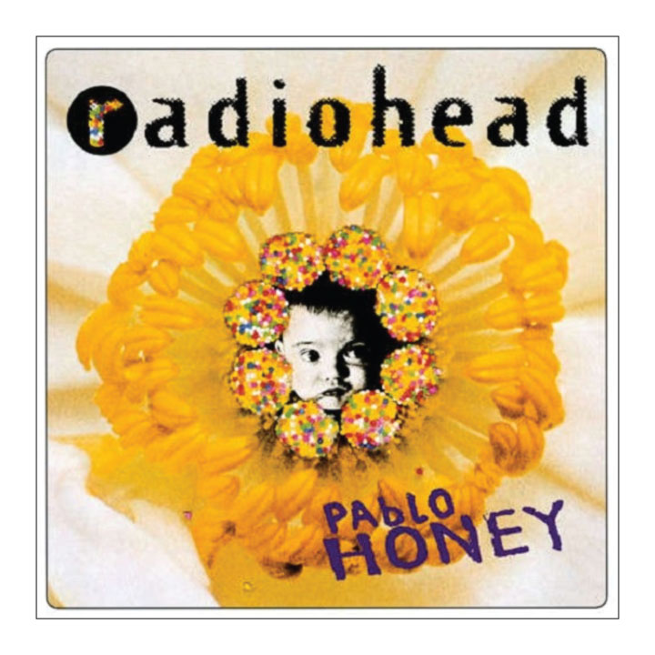 Album cover for 'Pablo Honey' by Radiohead featuring a yellow flower and a person's face.