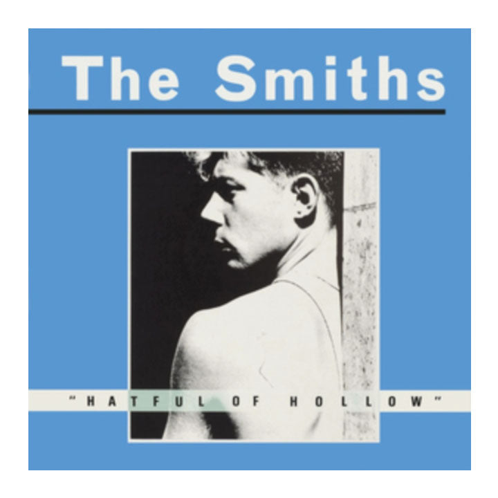 Album cover for 'Hatful of Hollow' by The Smiths with a blue border and black and white photo of a man.