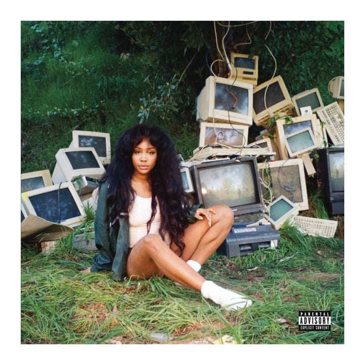 SZA sitting on grass around TV monitors. CTRL album cover