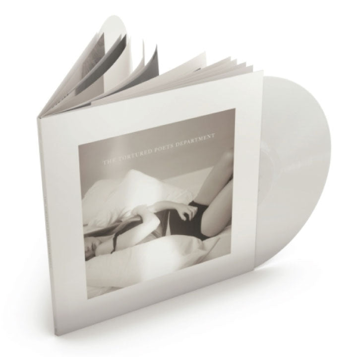 A vinyl record partially pulled from a slim white album case, with the record visible behind the cover. The cover features a monochrome photograph and the text 'THE FUTURED PORTS DEPARTMENT'.