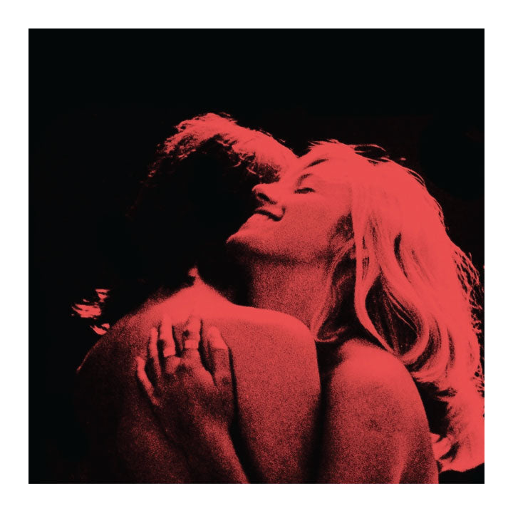 Red-toned silhouette of a couple embracing on a black background