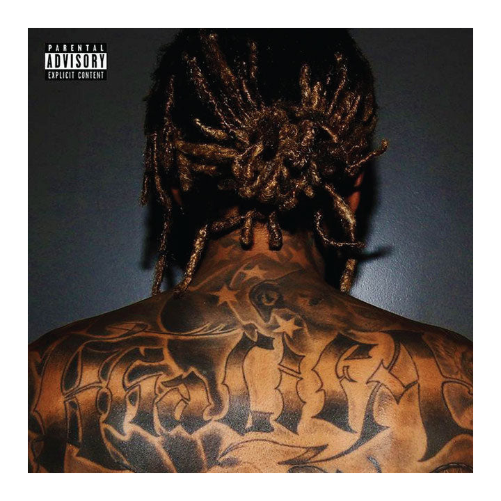 Wiz Khalifa with intricate tattoos on the back, wearing a headwrap against a dark background.