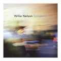 vinyl record cover for Willie Nelson's 'Songbird' featuring an abstract, motion-blurred painting with the text 'Willie Nelson Songbird' at the top.